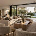 Open-plan sample living room connecting to a garden